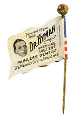 "DR. HYMAN AMERICAS GREATEST PAINLESS DENTIST" CELLULOID FLAG STICKPIN.