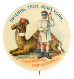 "INTERNATIONAL SHIRT & COLLAR CO." AD BUTTON WITH BIZARRE RITUAL SCENE AND GREAT COLOR.