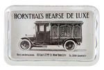 "HORNTHAL'S HEARSE DE LUXE" GLASS PAPERWEIGHT.