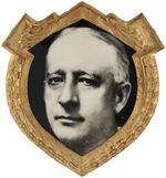 OUTSTANDING LARGE AL SMITH REAL PHOTO PORTRAIT IN EAGLE AND WREATH BRASS SHIELD.
