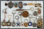 SHIP RELATED GROUP OF 22 METAL ITEMS WITH NUMEROUS KEY FOBS.