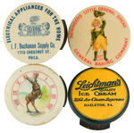 FOUR CELLULOID 1.25" CLICKERS.