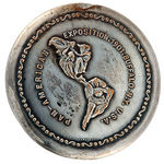 SILVERED BRASS POCKET MIRROR DEPICTING THE RAPHAEL BECK EXPOSITION LOGO.