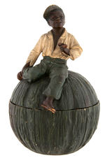 BLACK AMERICANA - BOY ON MELON FIGURAL TOBACCO JAR.