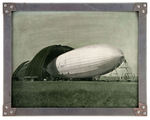 U.S.S. AKRON AIRSHIP FIRST LAUNCHING PHOTO IN ORIGINAL DURALUMIN METAL FRAME.