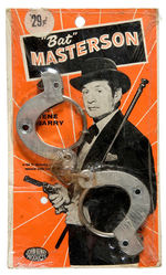 "BAT MASTERSON" HANDCUFFS ON ORIGINAL STORE CARD.