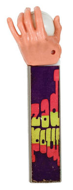 PSYCHEDELIC EYE IN HAND PEZ DISPENSER.