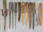 11 METAL LETTER OPENERS IN TIN, SILVERED BRASS, BRASS AND WOOD.