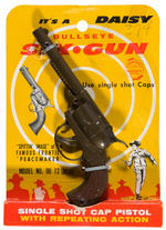 DAISY “BULLSEYE SIX-GUN” CAP PISTOL ON CARD.