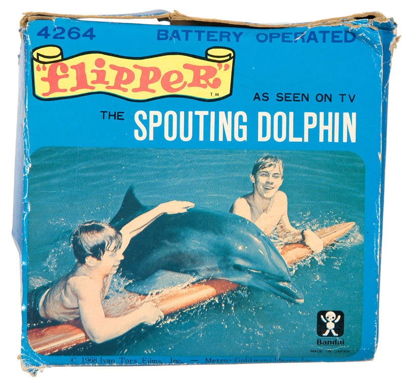 Hake's - “FLIPPER THE SPOUTING DOLPHIN” BATTERY-OPERATED WATER TOY.