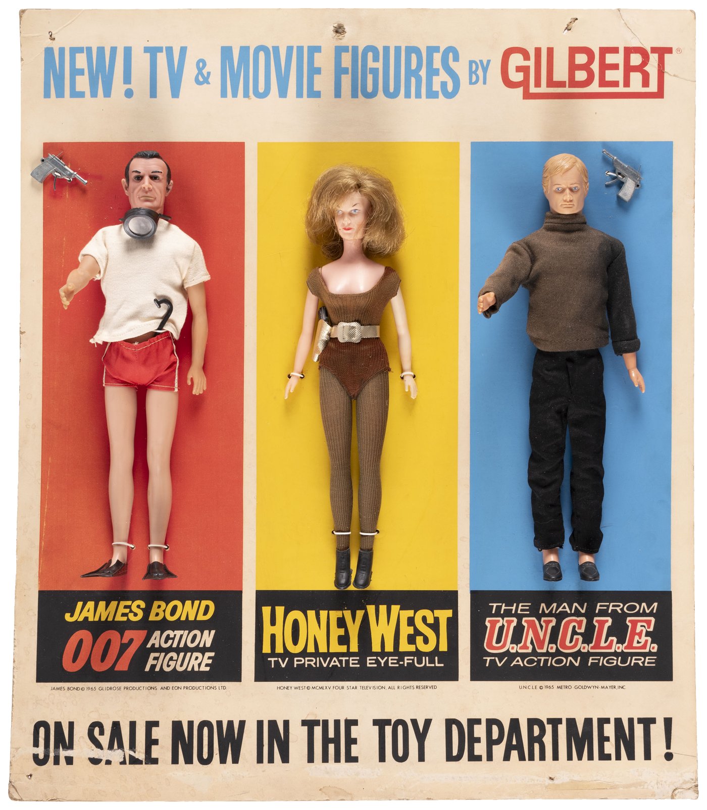 Hake's - JAMES BOND, HONEY WEST AND MAN FROM U.N.C.L.E. (ILLYA) GILBERT  DEPARTMENT TOY EASEL BACK DISPLAY.